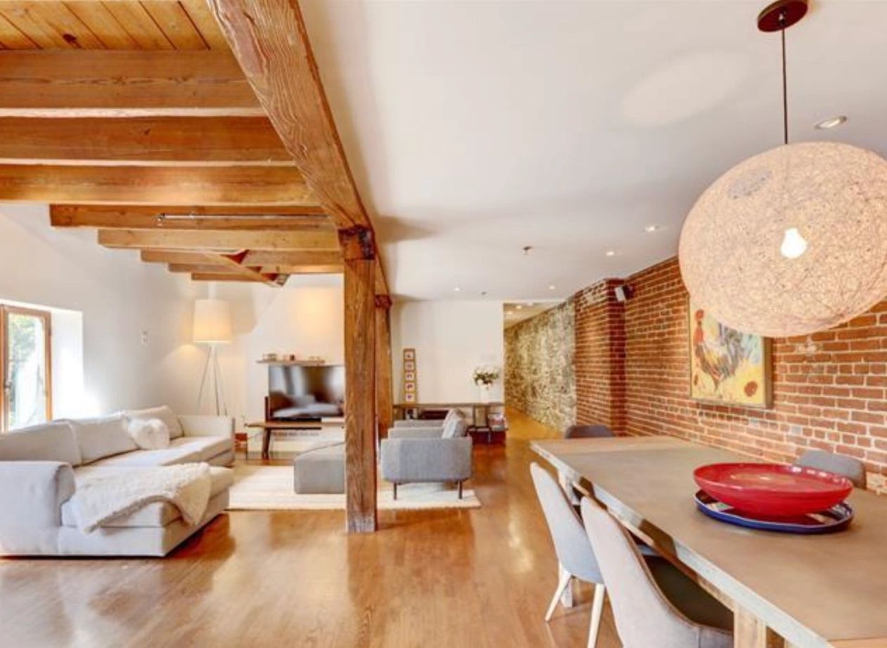 Loft with exposed brick and wooden beams